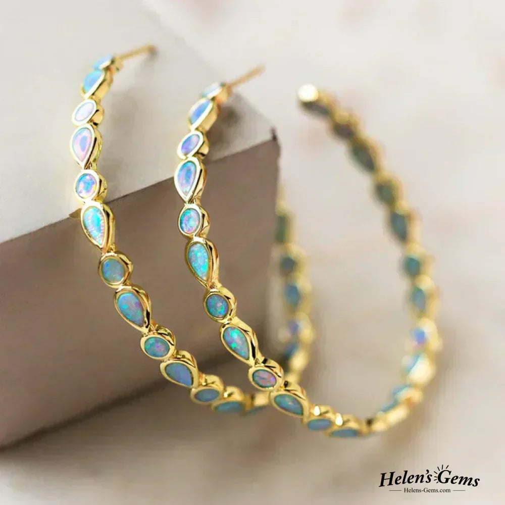 Boucles d'oreilles en opale bleue vintage avec cerceau en or